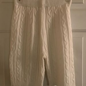 Knit, white high-waisted shorts.